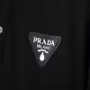 Prada Logo-plaque Terry-cloth Polo Shirt Black - luxurydeal